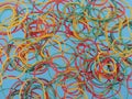 Colourful rubber bands on a blue background Royalty Free Stock Photo