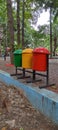 A colourful rubbish bin in a city park Royalty Free Stock Photo