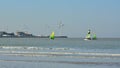 Colourful sailing boats in front of Port of zeebrugge