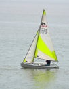 Colourful Sailing Dinghy on the North Sea at Felixstowe Suffolk England.