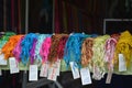 Colourful scarves line a shop window