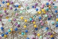 Colourful sewing pins background