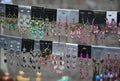 Colourful shinny earrings at the Nothinghill`s market Royalty Free Stock Photo