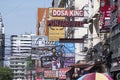 Colourful signboards for advertising hang on the buidling along Sukhumvit district of central Bangkok