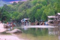 sunset and lush mountains in a fishing village Patong phuket thailand Long-tail boats and fishing timber huts long tail boats