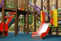Colourful slide outdoor playground for children in residential area Royalty Free Stock Photo