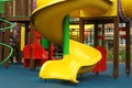 Colourful slide on outdoor playground for children in residential area Royalty Free Stock Photo