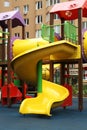 Colourful slide on outdoor playground for children in residential area Royalty Free Stock Photo