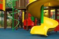 Colourful slide on outdoor playground for children in residential area Royalty Free Stock Photo