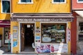 Colourful Specialita Alimentari drink shopfront in Burano, Italy