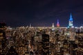 Colourful spikes on top of famous skyscrapers, Chrysler, Empire state and One Vanderbilt. Amazing night city scene Royalty Free Stock Photo