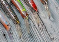 Colourful Spinning Lures On Wooden Background