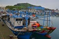 Colourful squid fishing boats at Tung-ao Fishing Harbor nearby Yehliu Geopark in Wanli District, New Taipei, Taiwan Royalty Free Stock Photo