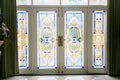 Colourful stained glass wooden door of a traditional