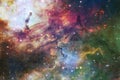 A colourful star forming region with sardust in deep space Royalty Free Stock Photo