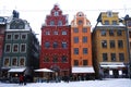 Colourful & x27;Stortorget& x27; in the winter snow, centre of Gamla Stan, Stockholm, Sweden.