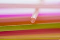 Colourful straws on a white background