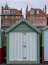 Colourful striped wooden beach hut on the sea front in Hove, Sussex, UK. Royalty Free Stock Photo