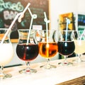 Colourful summer cocktails in glasses with straws. Drinks standing on the bar counter. Wine, pina colada and apple juice. Fresh Royalty Free Stock Photo