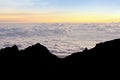 Colourful of sunrise scene with mist on silhouette of mount Kinabalu. Royalty Free Stock Photo
