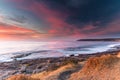 Colourful Coastal Sunrise Seascape with Clouds Royalty Free Stock Photo