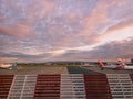 A colourful sunrise sky over Glasgow International Airport, Scotland