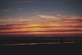 Colourful sunset over the beach at Polzeath Vintage Retro Filter