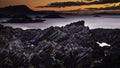 Colourful sunset on rocky beach, on west  coast of Scotland Royalty Free Stock Photo