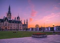 Colourful sunset sky over Parliament Hill, red tulips, Ottawa, Ontario, Canada Royalty Free Stock Photo