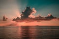 Colourful sunset in tropical islands with blue sky orange clouds and sun rays in Indian Ocean Royalty Free Stock Photo