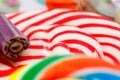 Colourful sweets candy rainbow and peppermint swirl lollipop close up