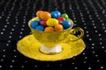 Colourful sweets in vintage teacup Royalty Free Stock Photo