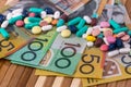Colourful tablets with australian dollars on wooden table Royalty Free Stock Photo