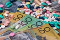 Colourful tablets with australian dollars on wooden table Royalty Free Stock Photo