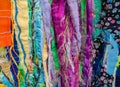 Colourful textured fabric strips sewn together. Textile art background.