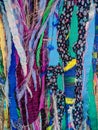 Colourful textured fabric strips sewn together. Textile art background.