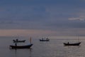 Colourful Thailand fishing boats at sunset wood fishing boats used in Asia for sustainable fishing in shallow seas