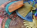 Colourful thin wood carved and fabric fan