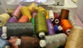 Colourful thread in spools in sewing box