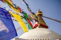 Colourful tibetan prayer flags wave in the air in the Boudhanath stupa in Kathmandu, Nepal Royalty Free Stock Photo