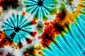 Colourful tie dyed pattern on cotton fabric background. Royalty Free Stock Photo