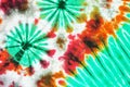 Colourful tie dyed pattern on cotton fabric background. Royalty Free Stock Photo