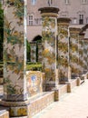 Colourful tiled pillars in the cloister garden at the Santa Chiara Monastery in Via Santa Chiara, Naples Italy.