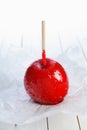 Colourful toffee apple on a stick