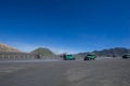 Colourful tourist jeeps in savanna of Tengger caldera