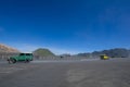 Colourful tourist jeeps in savanna of Tengger caldera