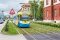 Colourful tram runs on tramway track over green grass area in Kosice SLOVAKIA, Translation = Ã¢â¬ÅTrain station square Royalty Free Stock Photo