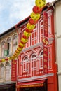 Colourful travel agent in Chinese shophouse in Temle street, Chinatown, Singapore