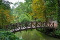 Colourful trees and old wooden bridge in Sofiyivsky park - Uman, Ukraine, Europe. Royalty Free Stock Photo