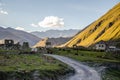 Colourful Truso Valley Gorge view of Ketrisi village and Zakagori fortress, and cows livestock in Kazbegi